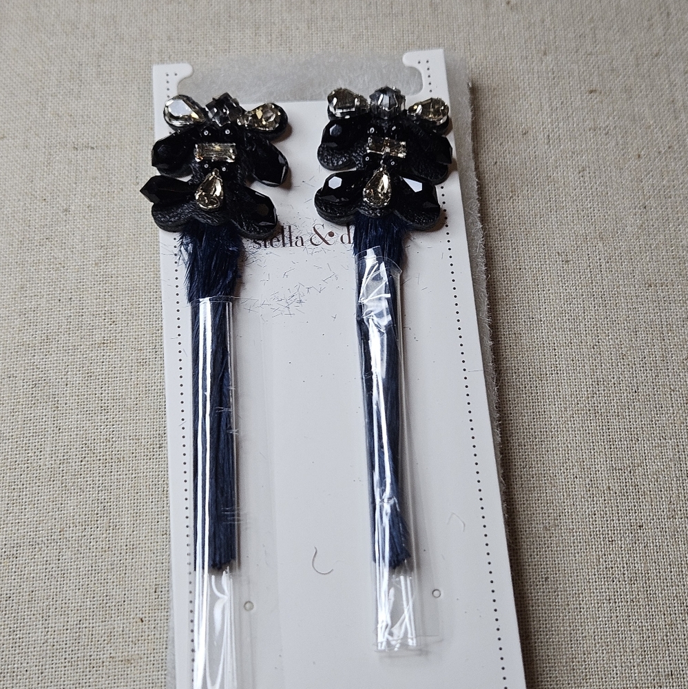 Navy blue feather earrings. Take you from day to evening.